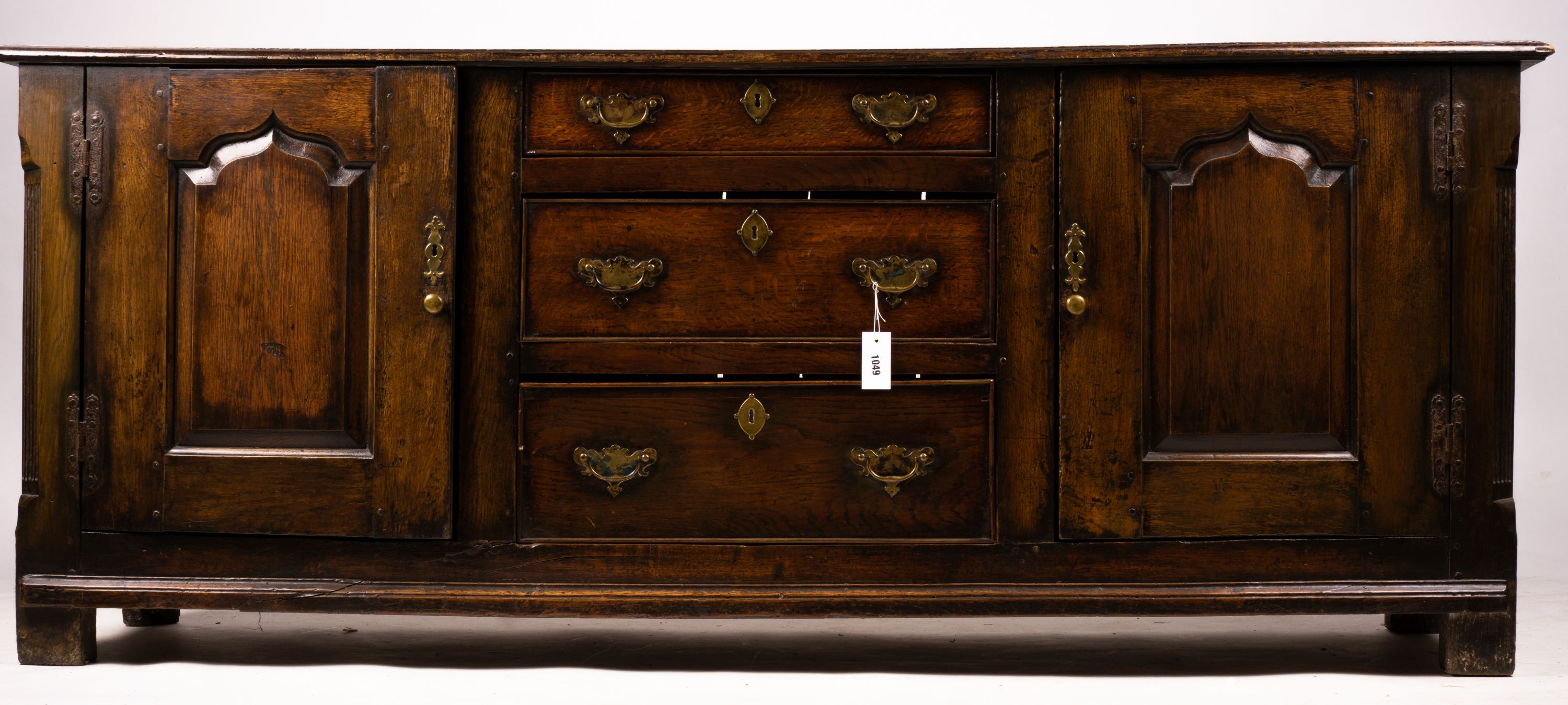 An 18th century oak low dresser base, length 191cm, depth 56cm, height 78cm